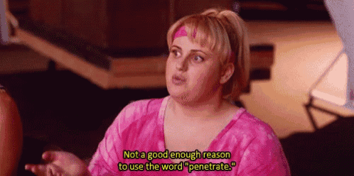 a woman in a pink shirt is talking to another woman .