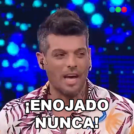 a man in a floral shirt is making a funny face and says enojado nunca .