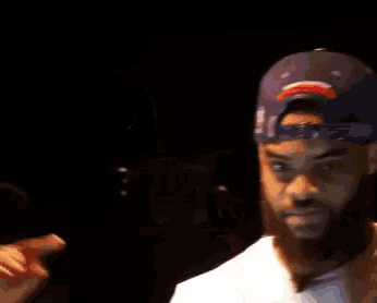 a man wearing a purple hat with the letter d on it