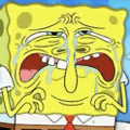 a close up of spongebob squarepants crying with his mouth open .