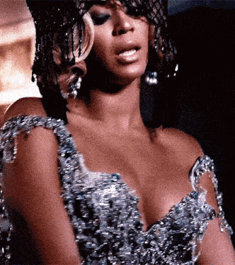 a close up of a woman wearing a very revealing dress