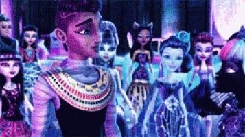 a group of monster high dolls are standing next to each other .