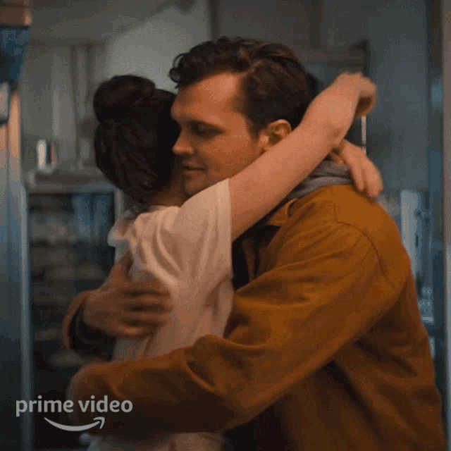 a man and a woman hugging with the words prime video behind them
