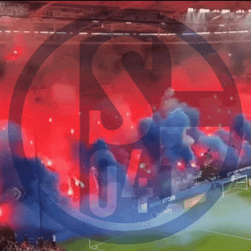 a soccer stadium with smoke coming out of the stands and the number 04 on the bottom