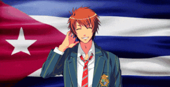 a man in a suit and tie stands in front of a flag
