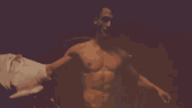 a man without a shirt has a tattoo on his chest that says a51
