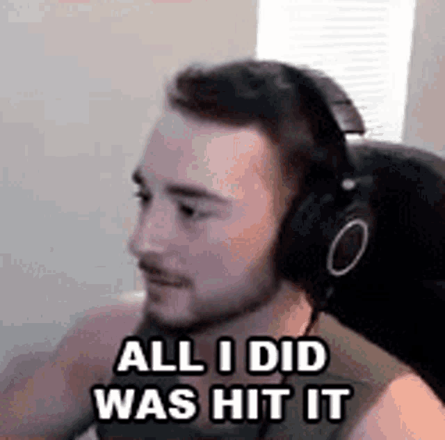 a man wearing headphones is sitting in a chair .