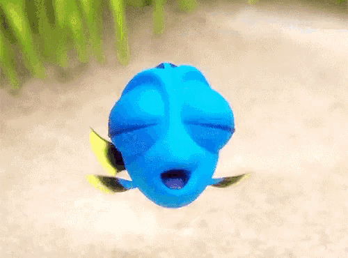 a blue fish with its eyes closed is floating in the air .
