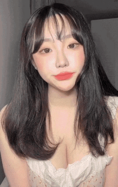a close up of a woman 's face with long hair
