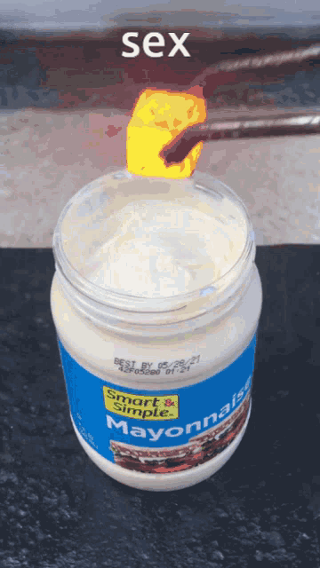 a jar of smart and simple mayonnaise with a piece of cheese on top