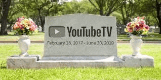 a gravestone in a cemetery with flowers and the words youtube tv written on it .