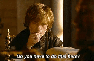 a man sitting in a chair with the words " do you have to do that here " above him