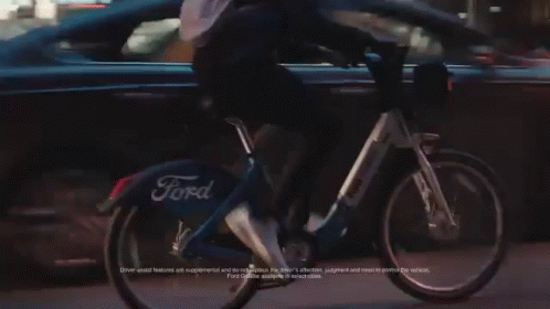Ford GIF - Riding A Bike Bicycle GIFs