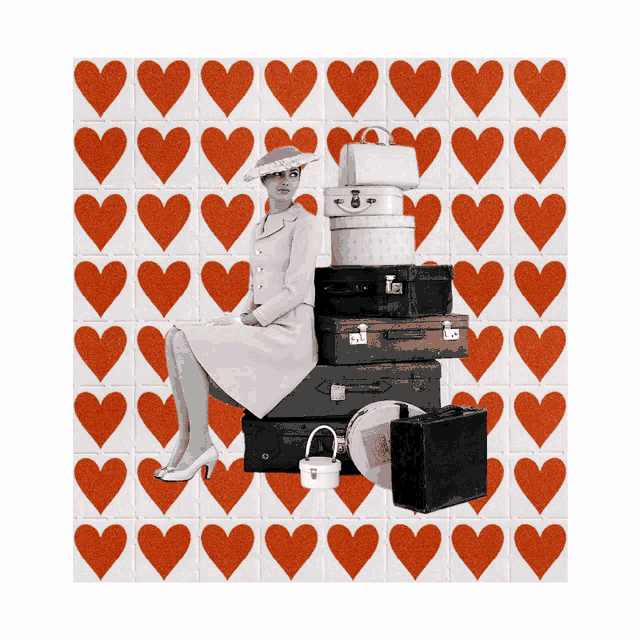 a woman sits on top of a pile of suitcases with hearts in the background