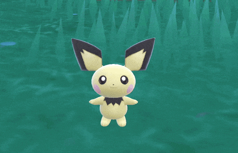 a yellow and black stuffed animal with a bow tie is in the water