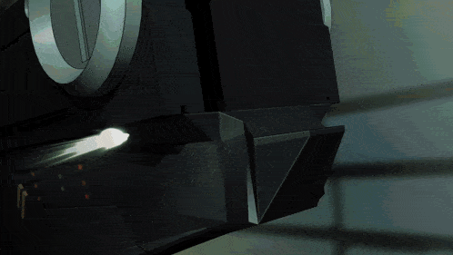 a close up of a black object with a white light coming out of it