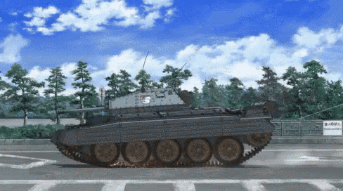 a tank with the letter s on the side is driving down a road