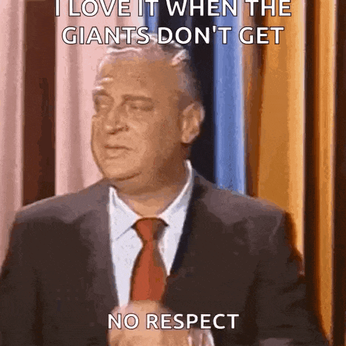 a man in a suit and tie is saying i love it when the giants don 't get no respect