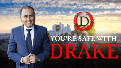 a man in a suit and tie is standing in front of a poster that says you 're safe with drake
