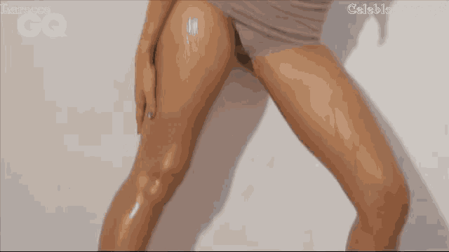 a close up of a woman 's legs with the words celeblounge.net visible
