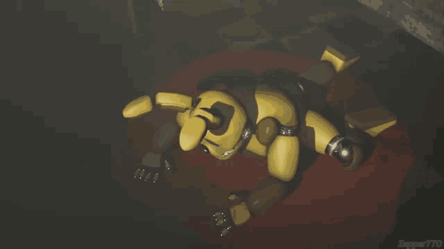 a yellow robot is laying on its back on a red carpet in a dark room