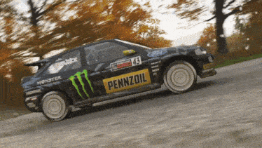 a pennzoil race car is driving down a dirt road