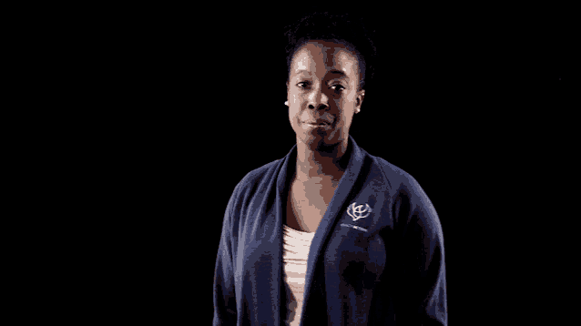 a woman wearing a blue sweater that says toyota