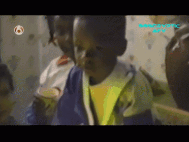 a child is sitting in front of a screen that says discovery