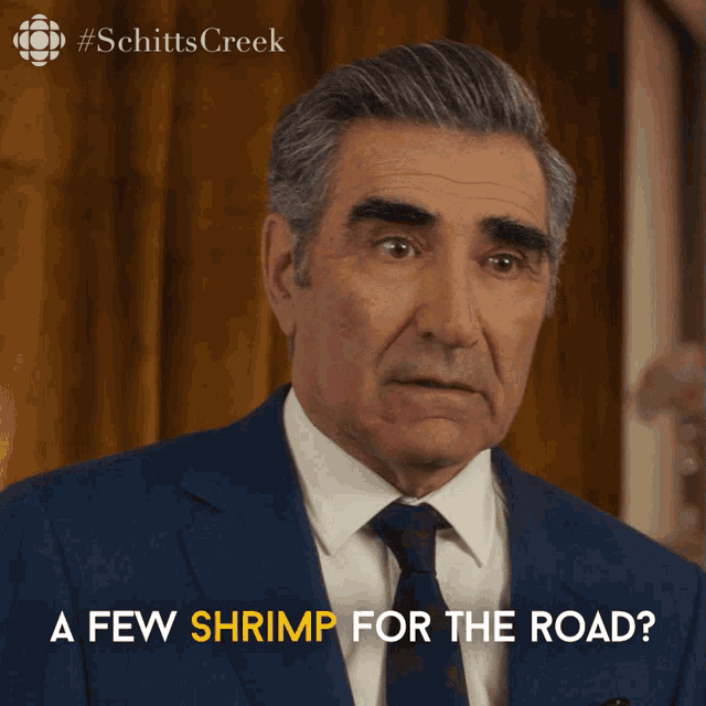 a man in a suit and tie is asking if there is a few shrimp for the road