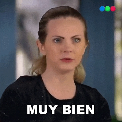 a woman is making a face and says muy bien in spanish