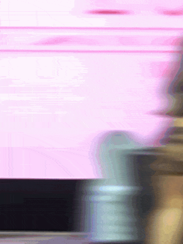 a blurred image of a pink background with a few lines