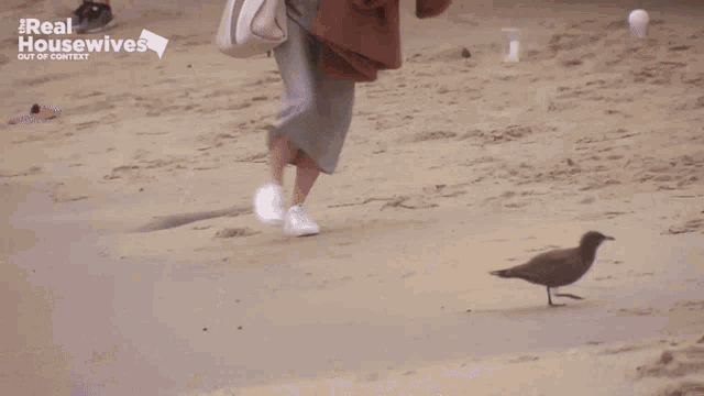 a woman walking on a beach with the words real housewives out of context on the bottom
