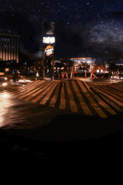 a car is driving down a street with a pizza hut sign behind it
