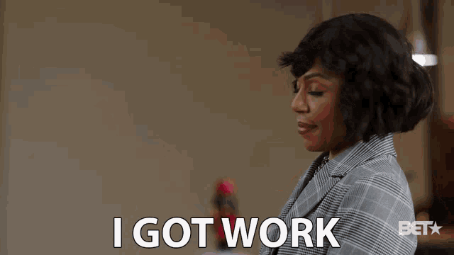 a woman says i got work while looking at a tablet