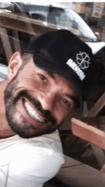 a man with a beard wearing a hat that says inova