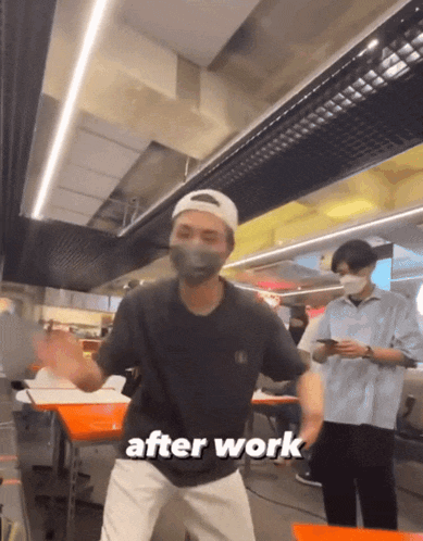 a man wearing a mask is dancing in a restaurant with the words after work written on the bottom