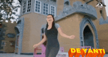 a woman dancing in front of a castle with the words deyanti written on the bottom