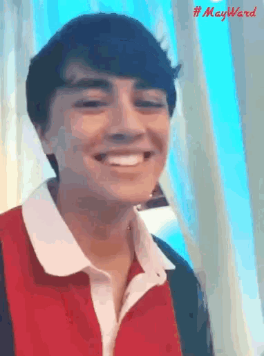 a man in a red and white shirt is smiling with the hashtag #mayward