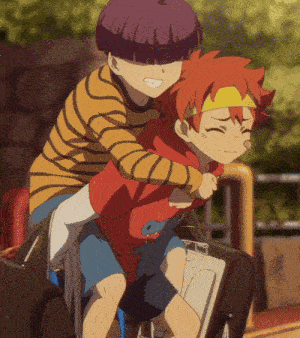 a boy in a striped shirt is carrying another boy in a red shirt