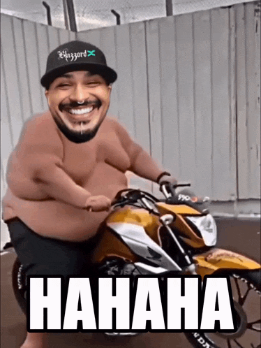 a shirtless man is riding a motorcycle with the word hahaha written on it