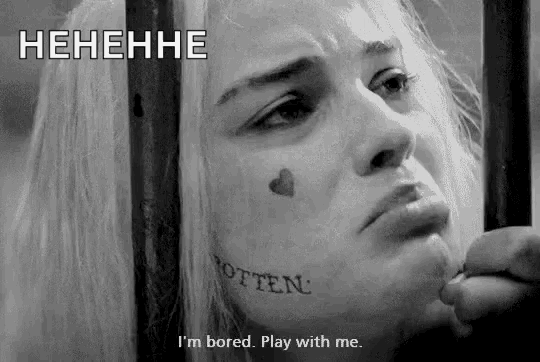 a woman with a tattoo on her face says i 'm bored . play with me .