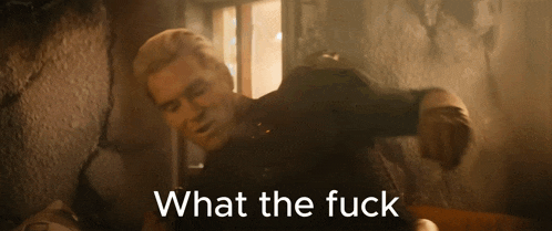a man in a dark room with the words " what the fuck " above him