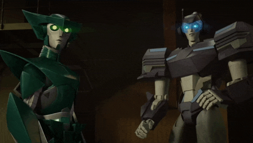 a couple of robots standing next to each other with green eyes