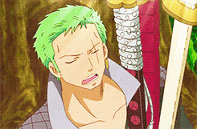 a man with green hair is laying on a bed next to a sword .