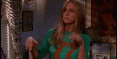 a woman is wearing a green shirt with the number 7 on it .