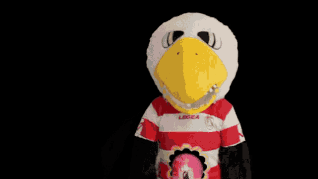 a mascot wearing a red and white striped shirt with the letter l on it