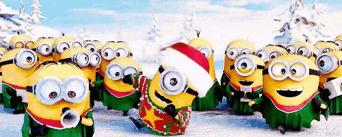a group of minions wearing santa hats and sweaters are standing in the snow .