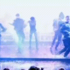 a blurry picture of a group of people standing next to each other in a pool .