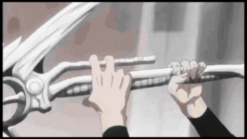 a person is holding a sword in their hand