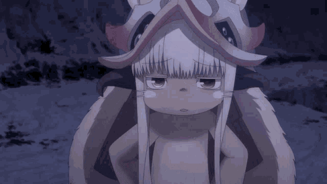 a cartoon character with white hair and red horns looks sad